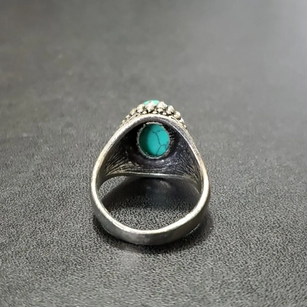Silver tone ring with blue stone approx 11
